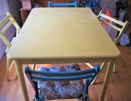 Table with 4 chairs and cushions