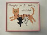 All of these are cross stitch done by the individual.   There are seven of them with all different sayings. This one says Happiness is being a mother.