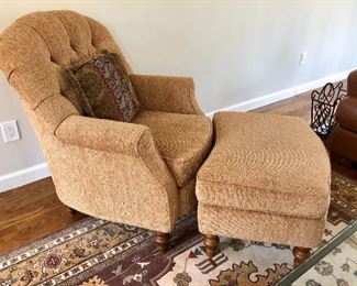 Upholstered chair with ottoman