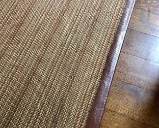 Interesting rug with leather edges