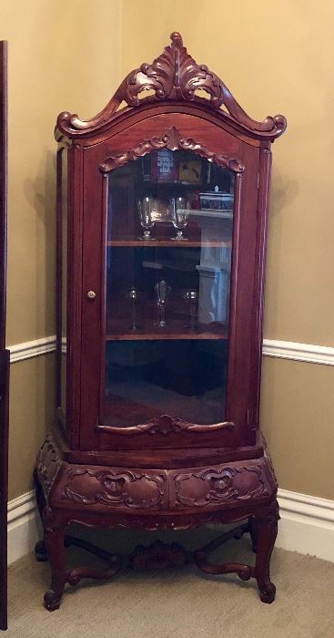 Vintage mahogany curio cabinet. Reproduction of 18th century Rococo style.