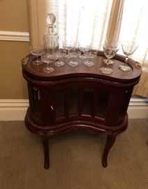 Hand carved mahogany kidney shaped end table. Removable tray. Beveled glass.