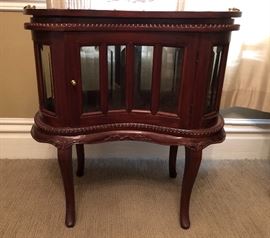 Hand carved mahogany kidney shaped end table. Removable tray. Beveled glass.