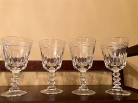 Set of four elegant glass goblets.