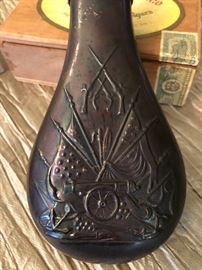 Brass and copper black powder flask.
Embossed Canon, crossed flags, and crossed Guns.