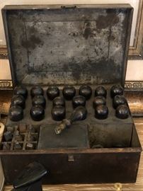 French ebonized  stamps and punches. Original metal, tin lined box, empty ink bottle, brush and stamp pad.