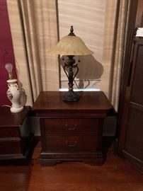 One of two matching bedside or end tables.