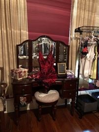 Mahogany  vanity with triple beveled mirrors.