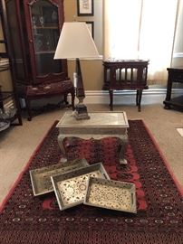 Pewter/silver embossed hammered metal table. Metal over wood. Tooled and hammered metal over wood trays.