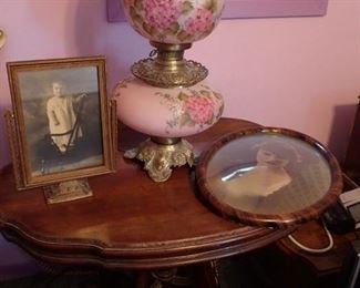 Antique lamp lights top and bottom / Antique table / Antique picture frames