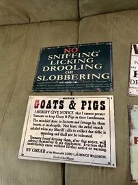 These vintage metal signs are from England