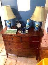 Beautiful antique dresser. The blue lamps are fabulous - they are like sculptures!
