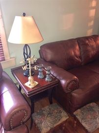 Closeup of the gorgeous leather couches. They are actually a brown color -the sun was a bit too bright in this picture
