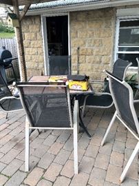 One of the stone topped patio tables