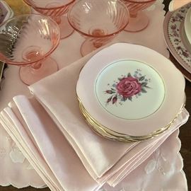 Pink vintage linens, china and glassware.