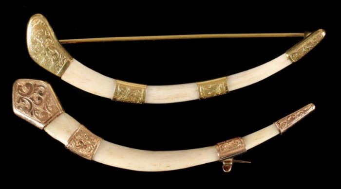 Description: Yellow gold 14k mounted bone faux ivory tusk type pins with incised decorations. Not marked but test 14k. 
Shipping weight: 1 ounce.