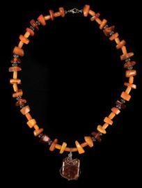 Description: Natural amber beads and pendant with silver wire and beads. 
Low Estimate: 150.0 
High Estimate: 200.0 
Condition: Good 
Length: 25 1/5 inches.
Condition Report: Good