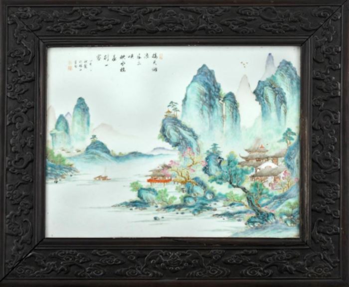 Chinese Framed Famille Rose Porcelain Plaque       Description: Porcelain plaque inscribed with a poem which means: "huge waves from Shanxia almost touch sky, an a unique tower building stands here with its reflection printed on the river". Signature translates: "made in the autumn of Yihai year in the officer house in Zhushan". The plaque mounted in a carved Zitan frame with bats in flight among clouds. The reverse sealed with a lacquer painted panel depicting buildings in a lanscape. 
Condition: Good 
Size: Sight: 12 1/4 x 16 1/4; Frame: 18 1/4 x 21 3/4 inches. 
Weight: 14 lbs.
Dimensions: 29 1/2 inches.
Condition Report: Good
Notes: 14 lbs.