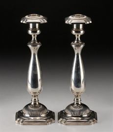 Pair of Fisher Sterling Weighted Candlesticks                   Description: Single socket candle sticks marked on the base: Fisher, Sterling Weighted, 386. The sockets marked: Fisher, hallmark, Sterling. 
Actual weight: 30.10 ounces troy. 
Condition: Very Good, a few minor dings. 
Height: 9 3/4 inches.
Condition Report: Very Good