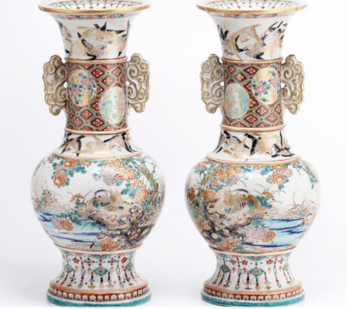 Pair of Japanese Satsuma Earthen Ware Vases                     Description: Pair of Satsuma vases decorated with ducks among foliage below two circling bands of flying swallows, double handles                                                   Shipping weight: 11 lbs 12 oz
