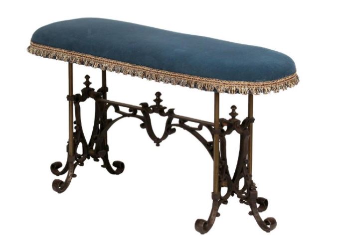 Victorian Cast Iron Upholstered Bench                                   Description: An elongated oval upholstered bench with wrought iron base.  
Height: 19 1/4 inches 
Width: 36 1/2 inches. 
Depth: 12 inches.  
Condition: New upholstery.
Dimensions: Figurine:13; Overall: 16 1/2 inches.

