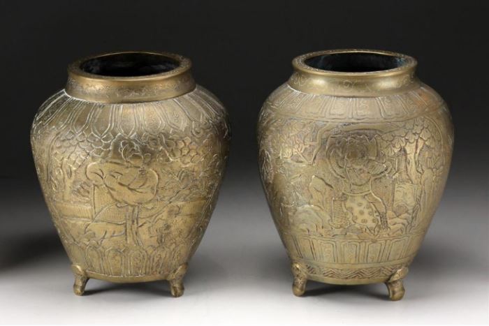 Pair of Chinese Late Qing Dynasty Carved Bronze Vases  Description: The pair of bronze vases with carved decoration raised on three animal form feet. Molded marked on the base: Da Ming Xuande Nian Zhi between two dragons, but late 19th century. 
Condition: Patina cleaned, a small pin hole to body of one. 
Height: 7 3/8 inches. 
Weight: 10 lbs.
Notes: 10 lbs.