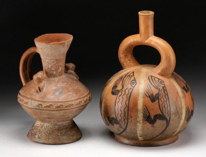 Two Precolumbian Style Ceramic Vessels           Description: Lot consist of two PreColumbian style ceramic vessels, a stirrup vessel and a ewer. 
Condition: Very Good 
Height: Height of Stirrup Vessel: 8 5/8 inches. 
Weight: 3 lbs.
Condition Report: Very Good
Notes: 3 lbs.