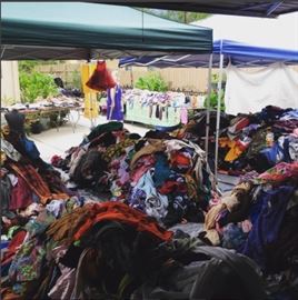 All clothing in the piles is $5 a piece or 5 pieces for $20 bucks