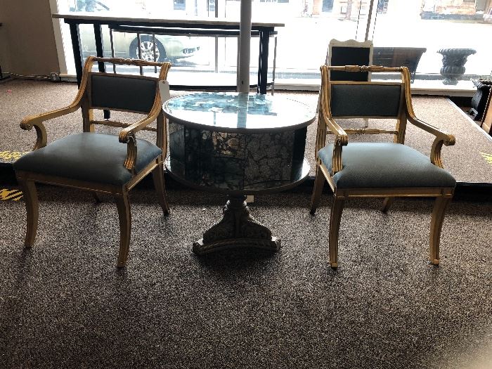Pair of Theodore Alexander chairs with gold vein mirror table. Table swivels! 