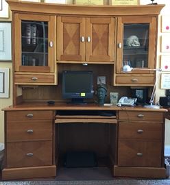 Cherry desk and hutch (2 Piece) colors are matching, the lighting caused the desk to appear darker.