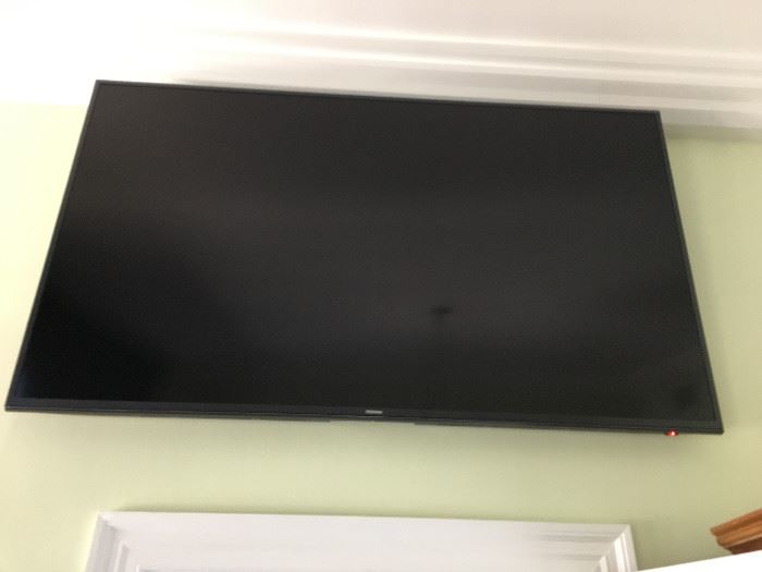 Samsung Series 7000 55" flat screen TV, mounted on wall, no base available.