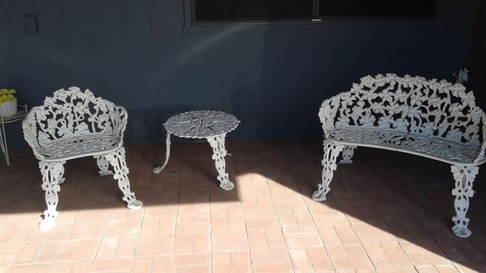 Wrought iron set includes love seat, table and chair