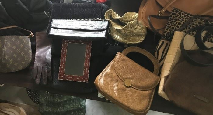 A collection of designer Purses, Clutch Bags....Louis Vuitton, Ralph Lauren, Gucci etc