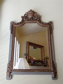 One of several GOOD vintage mirrors in this house. This one is hand carved wooden Italian, with gold gilt details.
