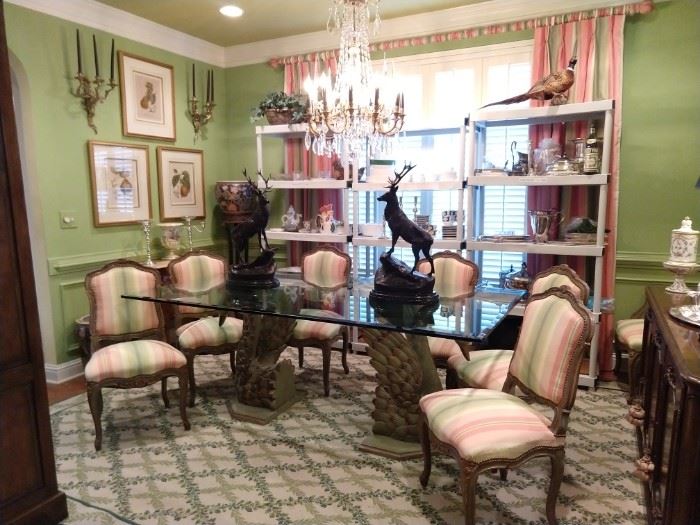 Nice Lily Pulitzer wannabe dining room! Set/8 vintage French dining chairs (2 arm, 6 sides) glass-topped dining tables, with fiberglass swan bases, pair of bronze stags, signed J. (Jules) Moigniez, framed botanicals, several sets of china, vintage Stark wool rug.