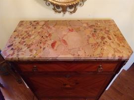 Marble top of the French writing desk.