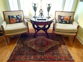 Wonderful pair of French bergere armchairs (by Collingswood Furn. Co, Collingswood, NJ) with fresh upholstery, one of a pair of amazing 4-drawer (2 real, 2 faux) mahogany drum tables, with tooled Greek- key-bordered leather tops, with glass tops, pair of celadon porcelain urns, with bronze mounts, Baccarat crystal reclining jaguar on base, all perched on a handsome vintage Persian Bidjar rug, hand woven, 100% wool face, measures 4' x 5'.