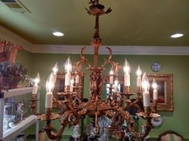 Vintage 10-light Spanish brass chandelier, with birds, putti and white glass candle sleeves.