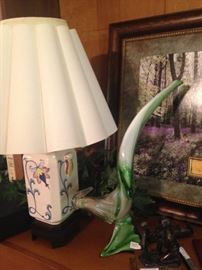 One of several lamps; glass bird