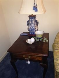 One of two matching blue & white lamps and side tables