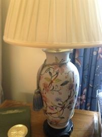 One of two matching pale blue lamps