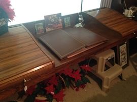 A third desk with roll top ends