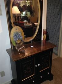 Cabinet and oval mirror