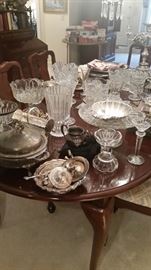 Lots of beautiful crystal, cut glass, silverplate serving pieces, candleholders, quality Statesville & Ross dining table, 2 extension leaves, 2 captains chairs, & 4 side chairs