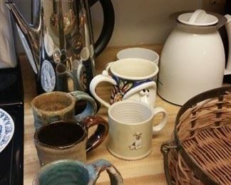 Coffee mugs (front handmade pottery cup says "GOAT"), dog mug SOLD, large face mug SOLD, coffee percolator, insulated coffee carafe, Gelavia double insulated tumbler coffee maker  (not shown)