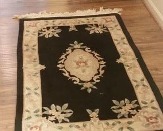 Smaller black rug