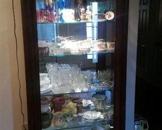 Lighted display cabinet, 4 glass shelves, side access doors, lots of goodies inside! Milk glass SOLD, art pottery SOLD,  blue pitcher & brown large vase SOLD,  