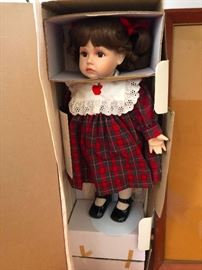Doll in a cardboard casket ready for burial after tragically dying by decapitation -- You need this!