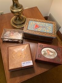 Two music boxes, a carved jewelry box with silk needlework and a glass box with seashells