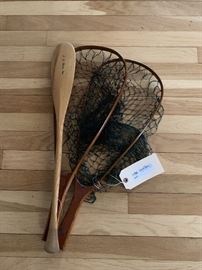 Two mahogany fishing nets together with an LL Bean miniature paddle